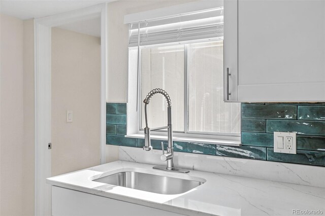 1130 Orchard St, Golden, CO 80401 - kitchen featuring a sink and light stone counters