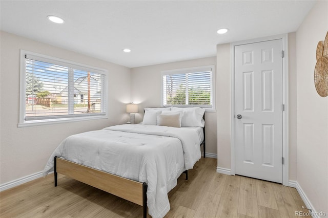 1130 Orchard St, Golden, CO 80401 - bedroom with light wood-style floors, baseboards, and recessed lighting
