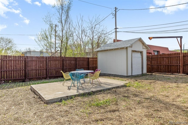 1130 Orchard St, Golden, CO 80401 - fenced backyard with a patio area, an outbuilding, and a shed