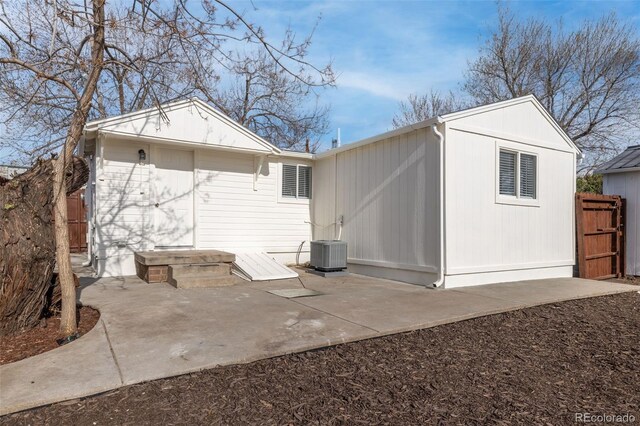 1130 Orchard St, Golden, CO 80401 - rear view of house featuring a patio, fence, and central AC