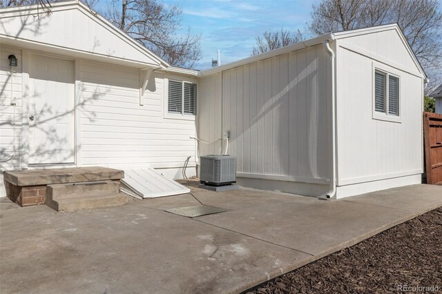 1130 Orchard St, Golden, CO 80401 - back of property with a patio and cooling unit