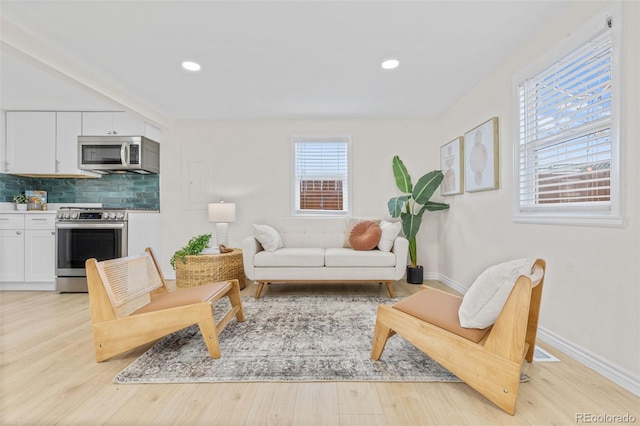 1130 Orchard St, Golden, CO 80401 - living room with light wood finished floors, baseboards, and recessed lighting