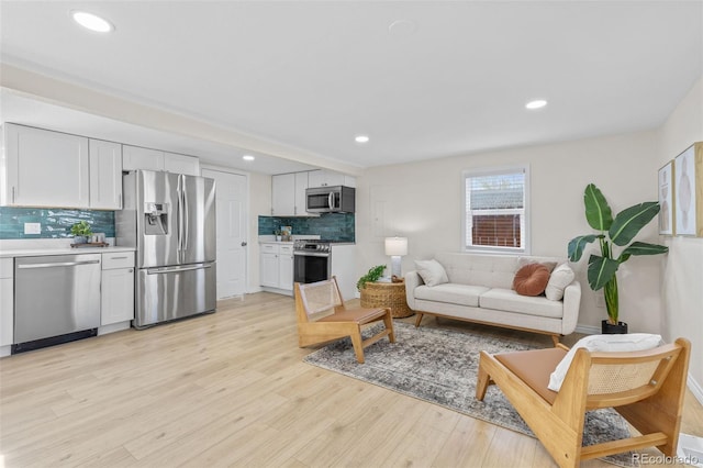 1130 Orchard St, Golden, CO 80401 - living area with light wood-style flooring and recessed lighting