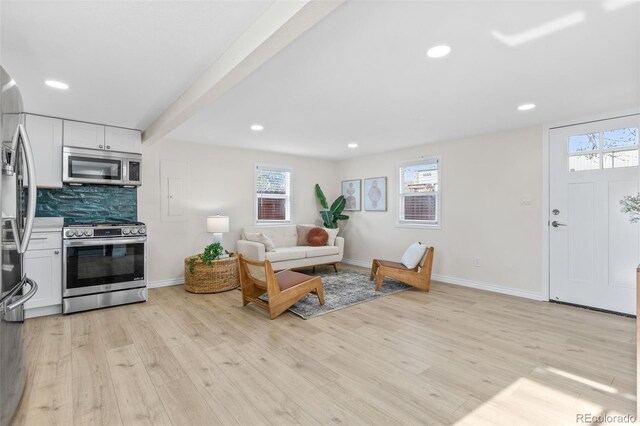 1130 Orchard St, Golden, CO 80401 - living area with light wood finished floors, baseboards, and recessed lighting