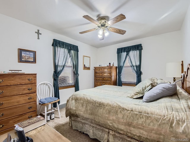 carpeted bedroom with ceiling fan