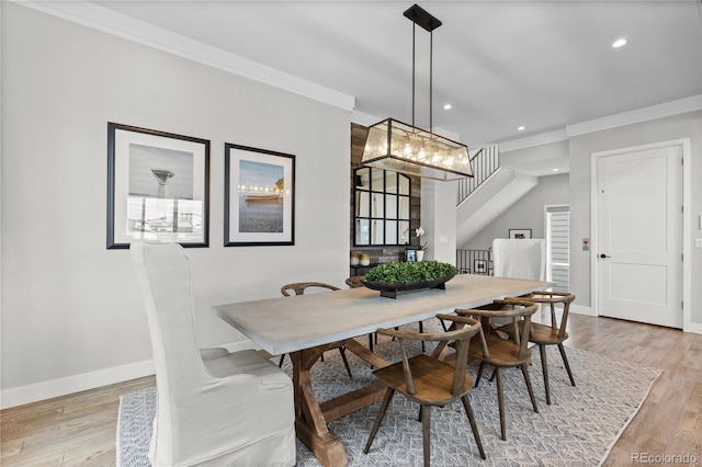 10113 Bellwether Ln, Lone Tree, CO 80124 - dining area featuring an inviting chandelier, baseboards, light wood-style floors, ornamental molding, and recessed lighting