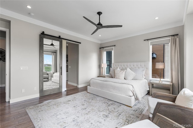 10113 Bellwether Ln, Lone Tree, CO 80124 - bedroom with crown molding, a barn door, recessed lighting, baseboards, and wood finished floors