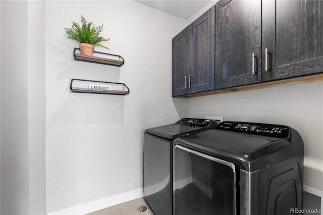 10113 Bellwether Ln, Lone Tree, CO 80124 - laundry area featuring light tile patterned floors, separate washer and dryer, baseboards, and cabinet space