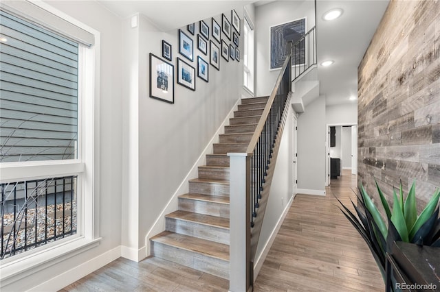 10113 Bellwether Ln, Lone Tree, CO 80124 - stairway featuring recessed lighting, baseboards, wood finished floors, and an accent wall