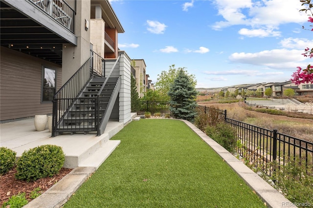 10113 Bellwether Ln, Lone Tree, CO 80124 - view of yard with a fenced backyard and stairway