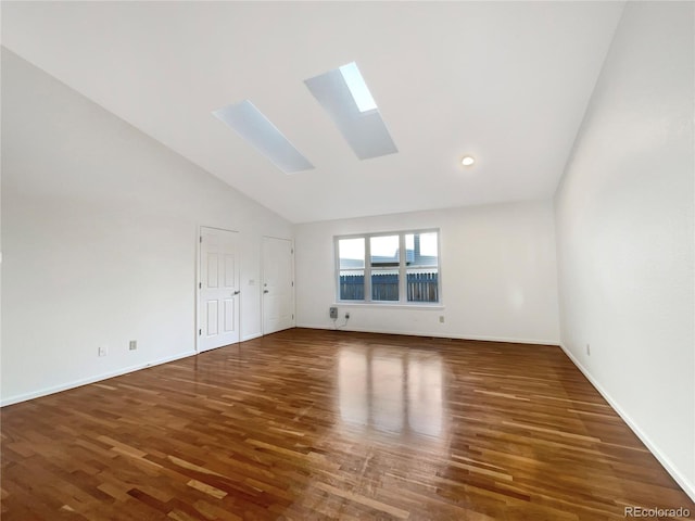 12375 Ivy Pl, Brighton, CO 80602 - unfurnished room with a skylight, wood finished floors, and high vaulted ceiling