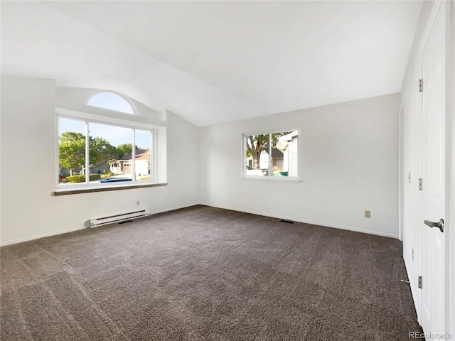 12375 Ivy Pl, Brighton, CO 80602 - empty room with vaulted ceiling, dark carpet, and baseboard heating