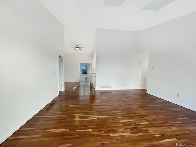 12375 Ivy Pl, Brighton, CO 80602 - unfurnished living room featuring high vaulted ceiling and wood finished floors