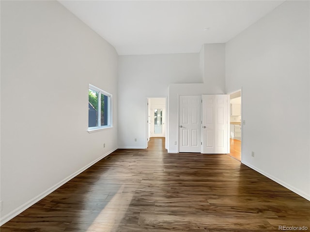 12375 Ivy Pl, Brighton, CO 80602 - unfurnished bedroom featuring a towering ceiling and dark wood finished floors