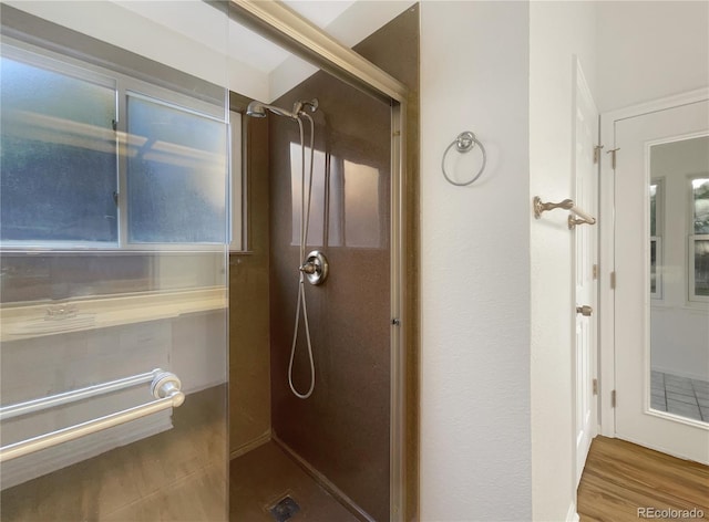 12375 Ivy Pl, Brighton, CO 80602 - full bath with a walk in shower and wood finished floors
