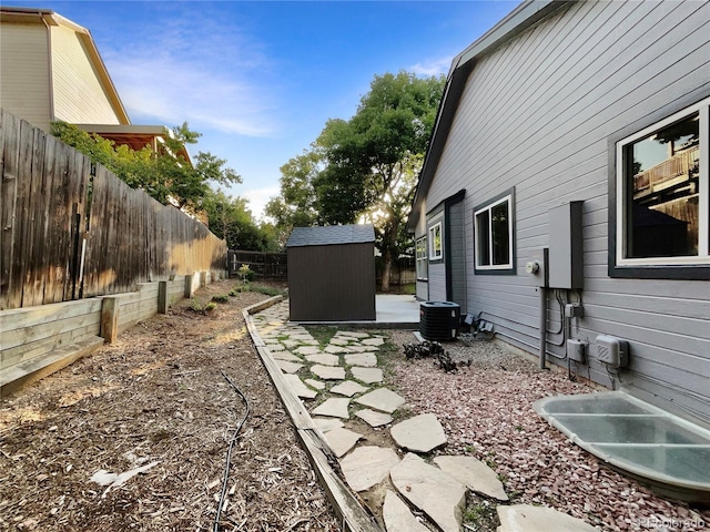 12375 Ivy Pl, Brighton, CO 80602 - fenced backyard featuring a storage shed