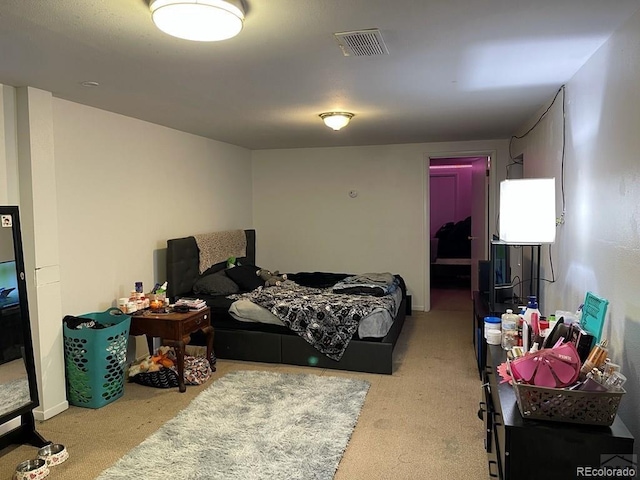 bedroom featuring light carpet