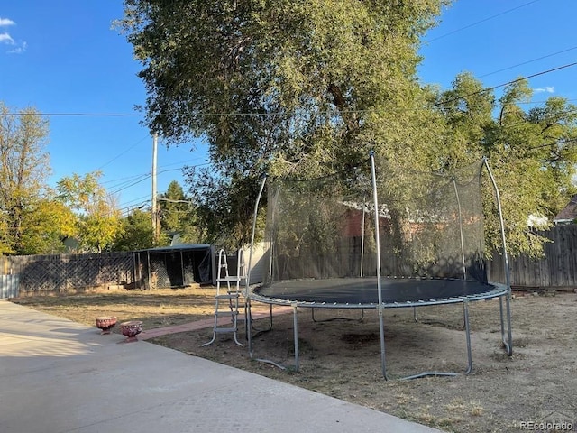 view of yard featuring a trampoline