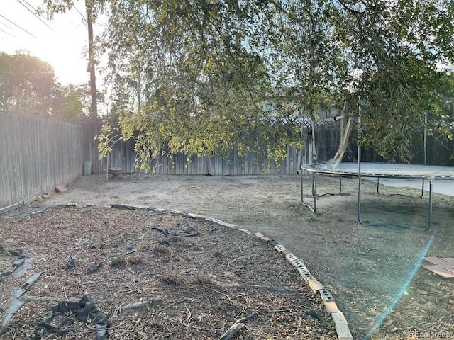 view of yard featuring a trampoline