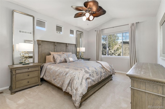 carpeted bedroom featuring ceiling fan and vaulted ceiling