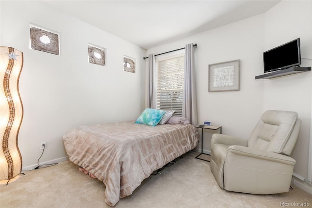 bedroom with light carpet