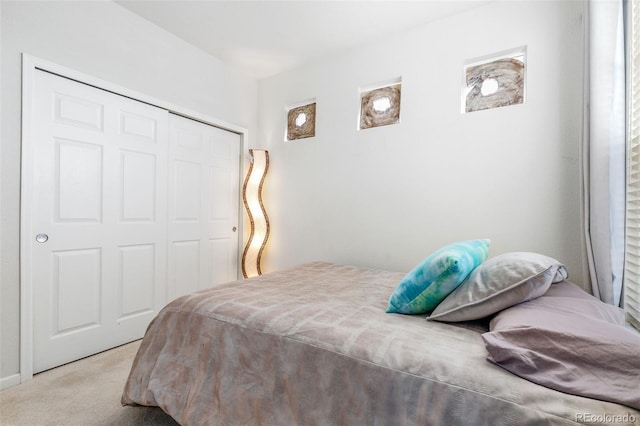 carpeted bedroom featuring a closet