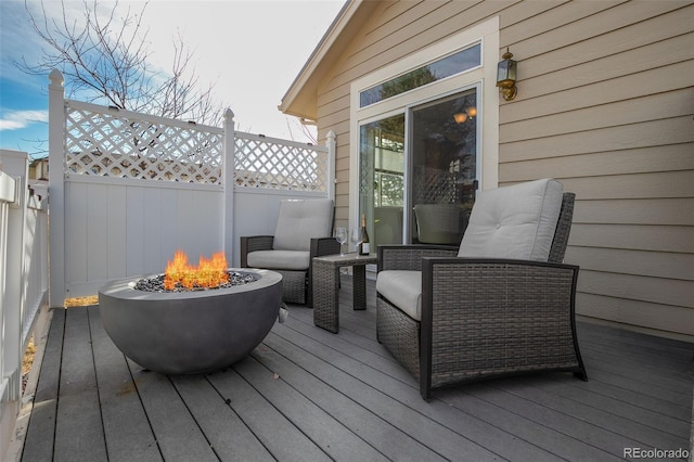 deck with an outdoor fire pit