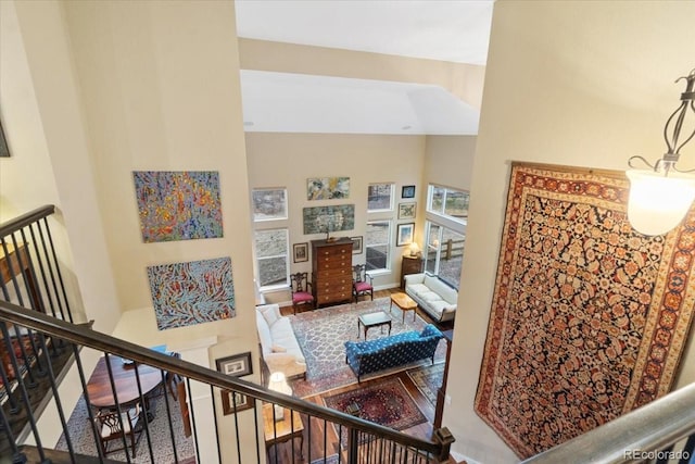 stairway featuring a high ceiling