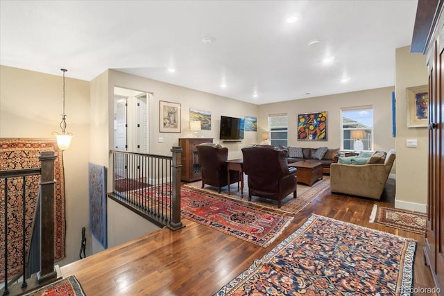 living area featuring wood-type flooring and recessed lighting