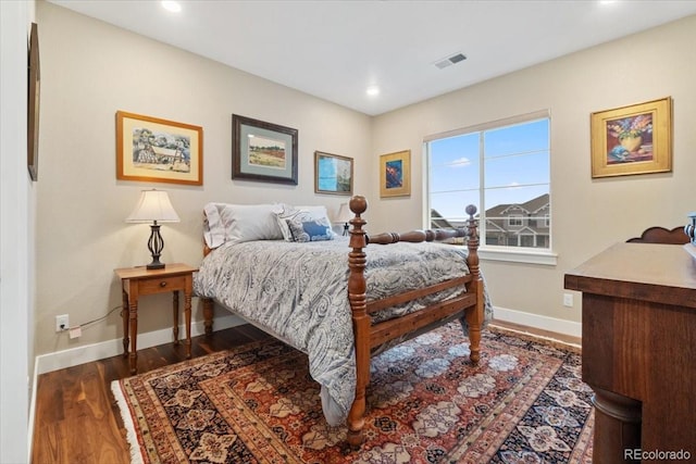 bedroom with baseboards, recessed lighting, visible vents, and dark wood-style flooring