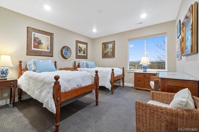 bedroom with baseboards, recessed lighting, dark colored carpet, and visible vents
