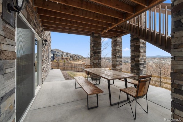 view of patio featuring outdoor dining area and a fenced backyard