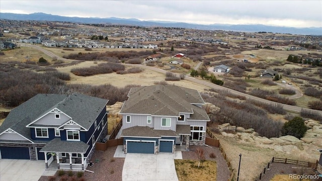 drone / aerial view featuring a mountain view