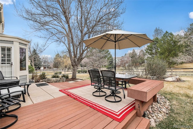 wooden terrace with outdoor dining space