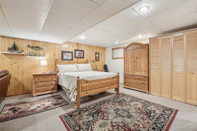 carpeted bedroom featuring a closet and recessed lighting