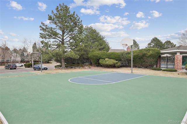 view of basketball court with community basketball court and fence