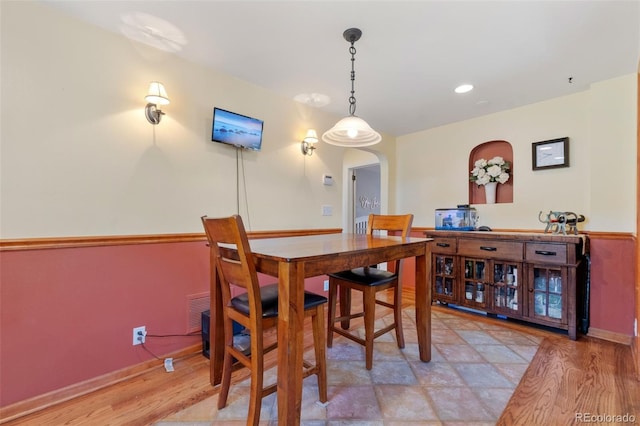 dining area with hardwood / wood-style floors