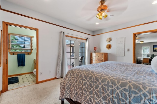 carpeted bedroom with ensuite bath, french doors, access to exterior, and ceiling fan