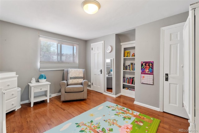 living area with wood-type flooring