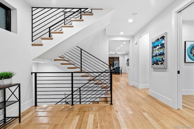 entrance foyer with recessed lighting, baseboards, and wood finished floors