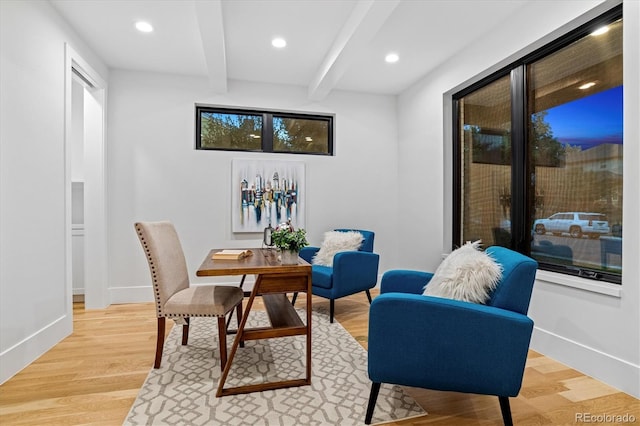 living area with recessed lighting, light wood-style floors, baseboards, and beam ceiling