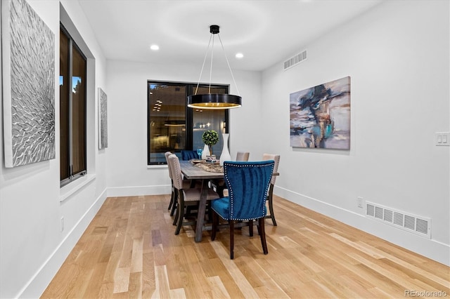 dining room featuring recessed lighting, visible vents, baseboards, and wood finished floors