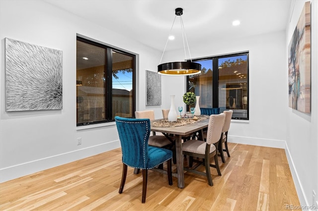 dining room featuring recessed lighting, baseboards, and wood finished floors
