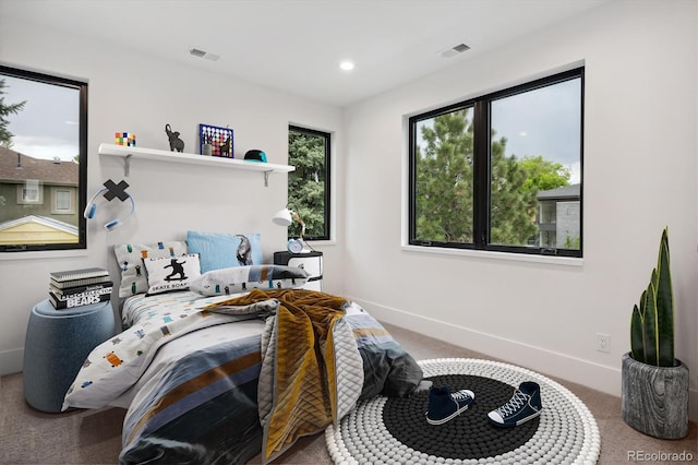 bedroom with visible vents, baseboards, and carpet floors