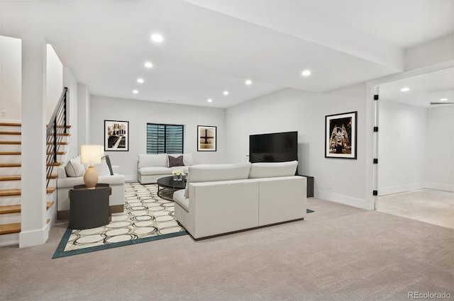 living area with recessed lighting, light carpet, and stairs