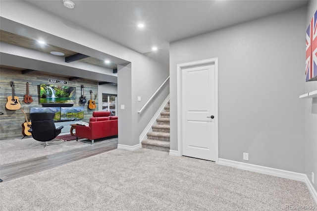 carpeted living area with stairway, recessed lighting, and baseboards