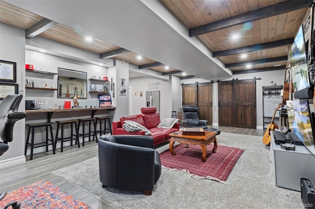 living room featuring a barn door, bar area, wood ceiling, and beam ceiling