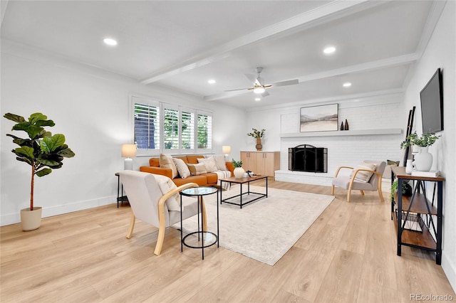 6716 W Rowland Ave, Littleton, CO 80128 - living area with beam ceiling, light wood-style flooring, a ceiling fan, a fireplace, and baseboards