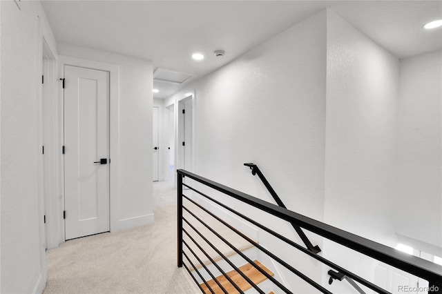 6716 W Rowland Ave, Littleton, CO 80128 - corridor featuring an upstairs landing, light carpet, recessed lighting, and baseboards