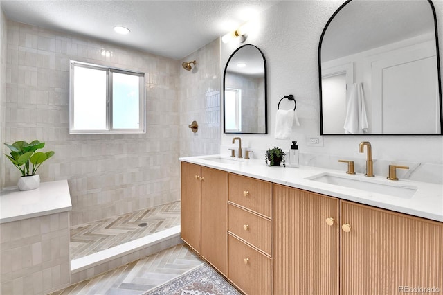 6716 W Rowland Ave, Littleton, CO 80128 - bathroom featuring double vanity and walk in shower